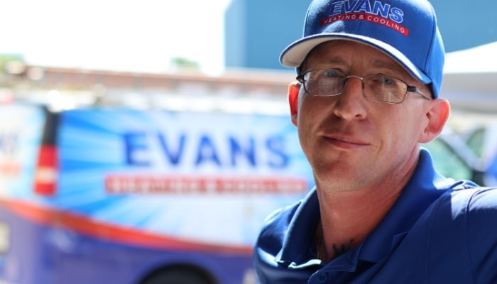 Evans Worker With Van In Background Evans Worker With Van In Background