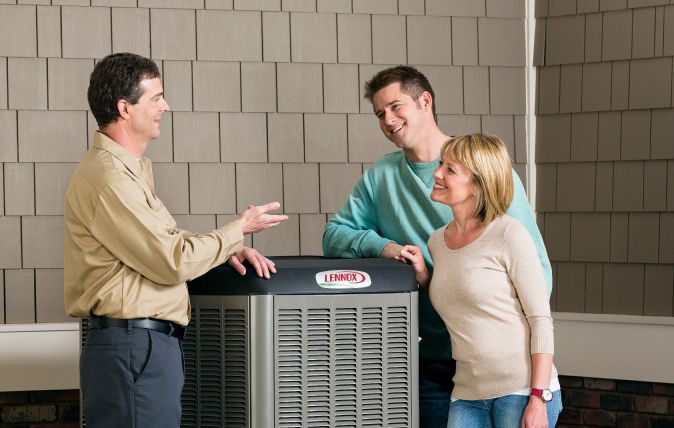 Lennox Dealer Customers Talking With Technician